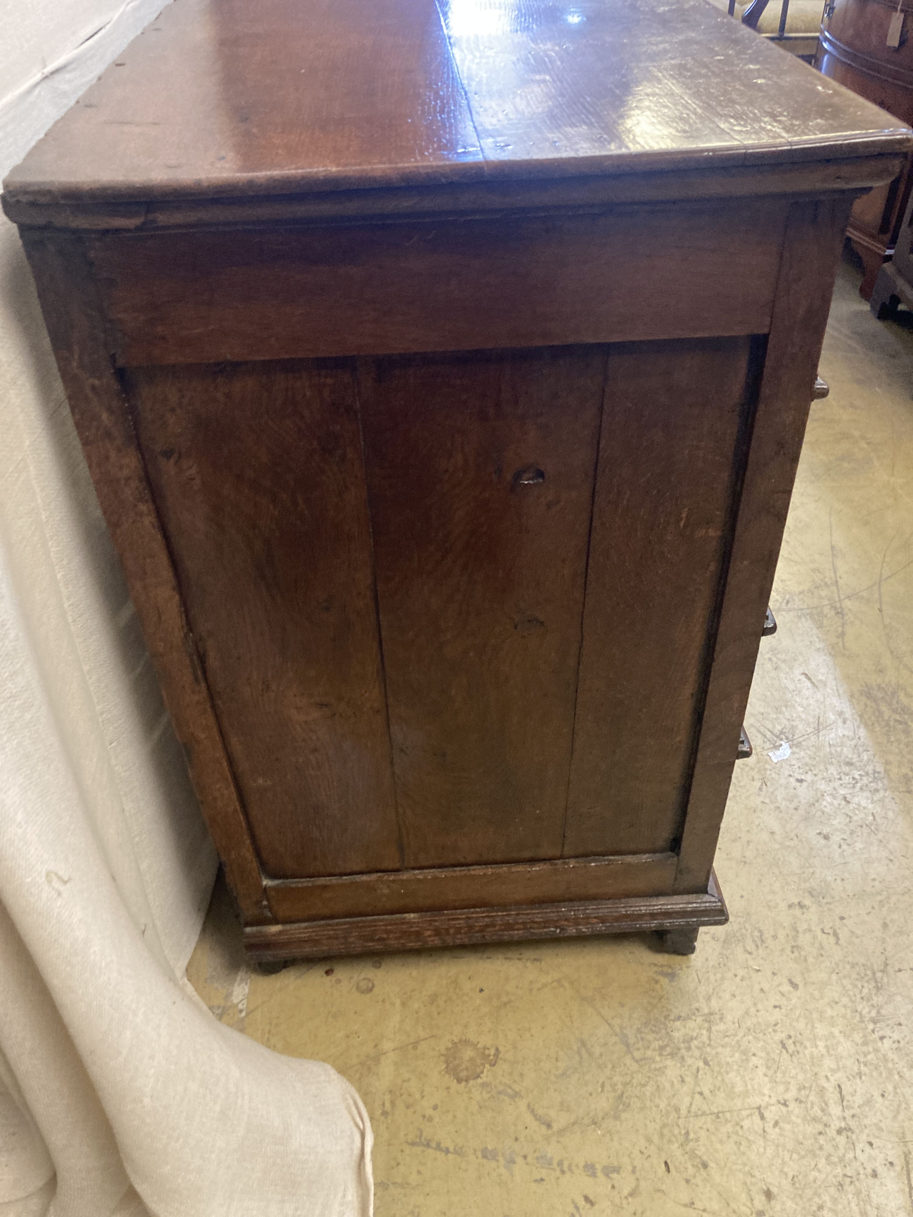 An oak and walnut chest, circa 1700, fitted two short drawers and three long drawers with mitred moulding